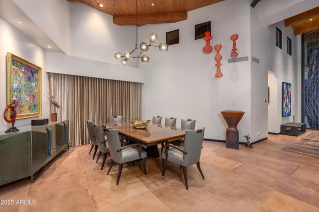 a room with gym equipment and wooden floor