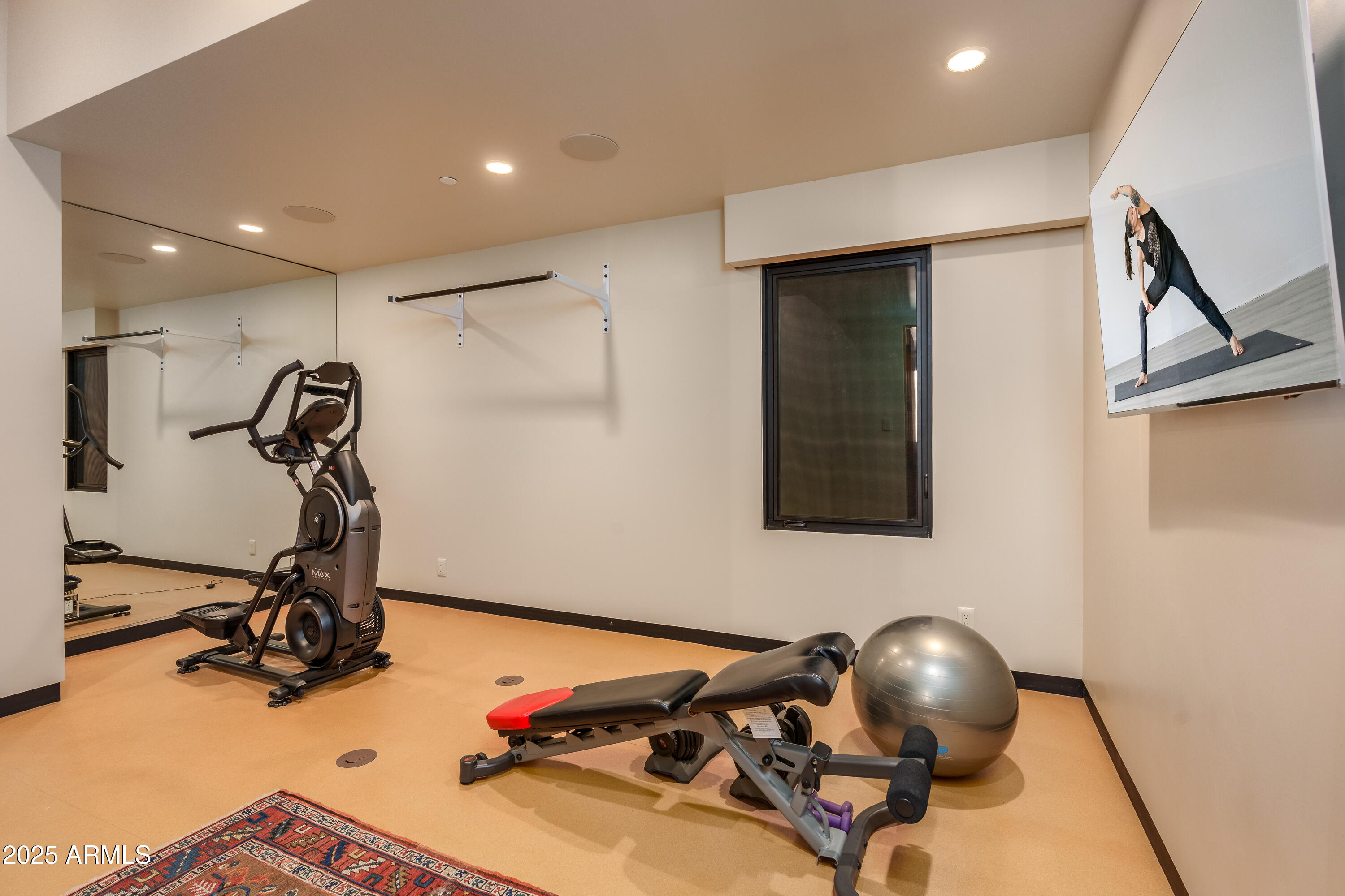 120 Paisano Road Sedona, AZ 86336 - Photo 22 of 63 a room with gym equipment and wooden floor