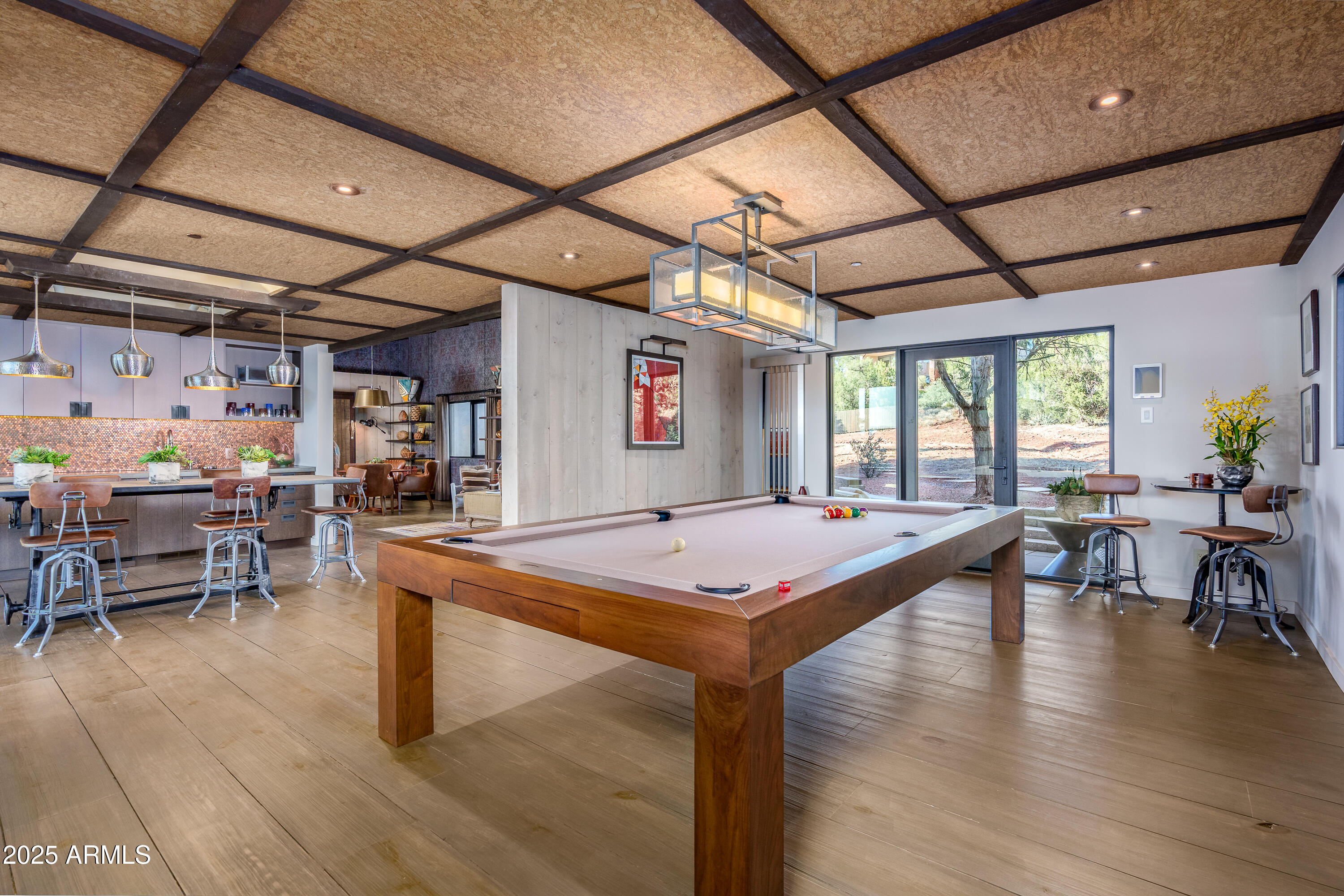 120 Paisano Road Sedona, AZ 86336 - Photo 38 of 63 a room with lots of table tennis table and a chandelier