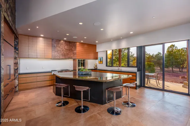 a kitchen with a sink and a large window