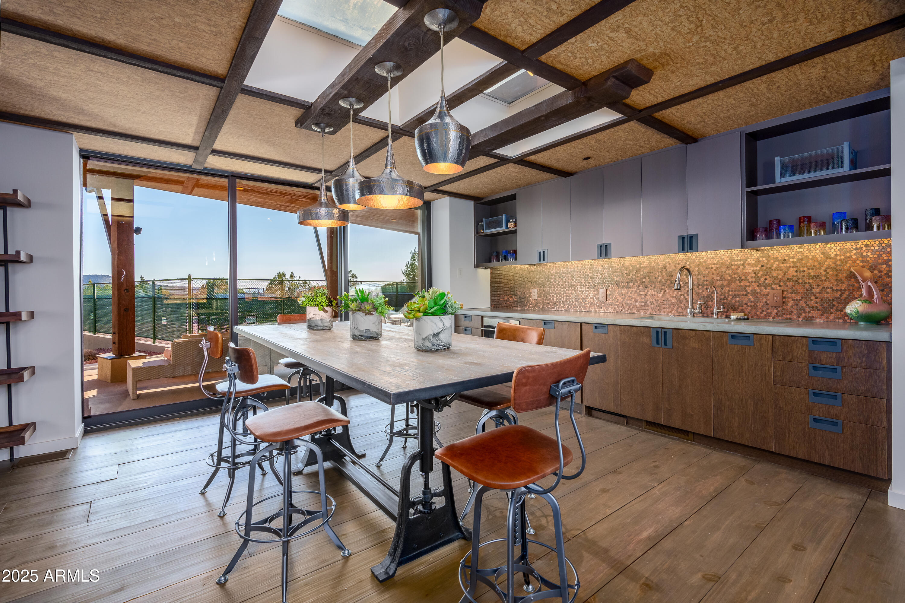 120 Paisano Road Sedona, AZ 86336 - Photo 41 of 63 a kitchen with a table and chairs in it