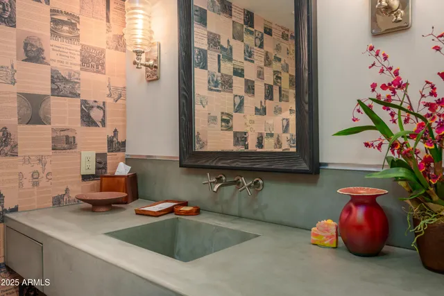 a view of a patio with table and chairs under an umbrella