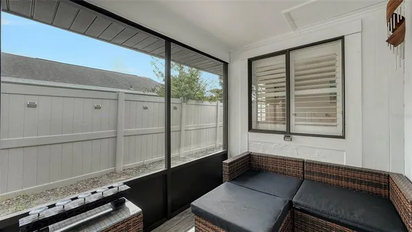 a kitchen with stainless steel appliances granite countertop a sink a stove a dining table and chairs