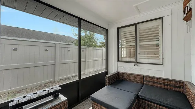 a kitchen with stainless steel appliances granite countertop a sink a stove a dining table and chairs