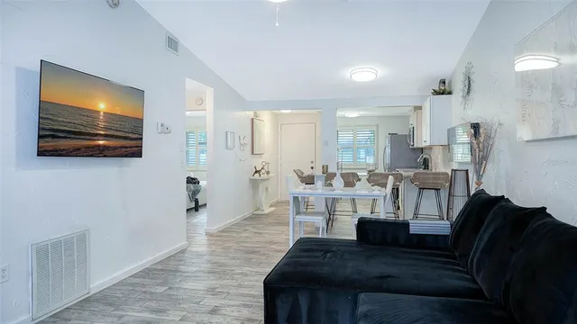 a kitchen with a stove a sink and a microwave