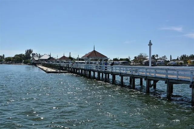 a front view of a building with a garden