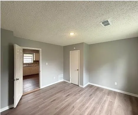 a view of a livingroom with wooden floor