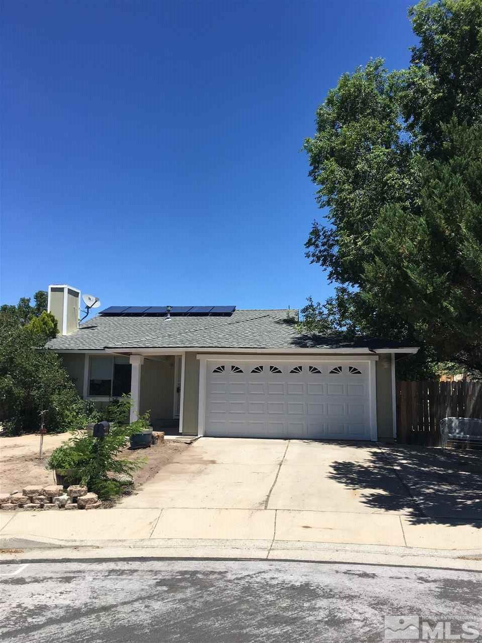 10003 Albite Street Reno, NV 89506 - Photo 1 of 25 a front view of a house with a space