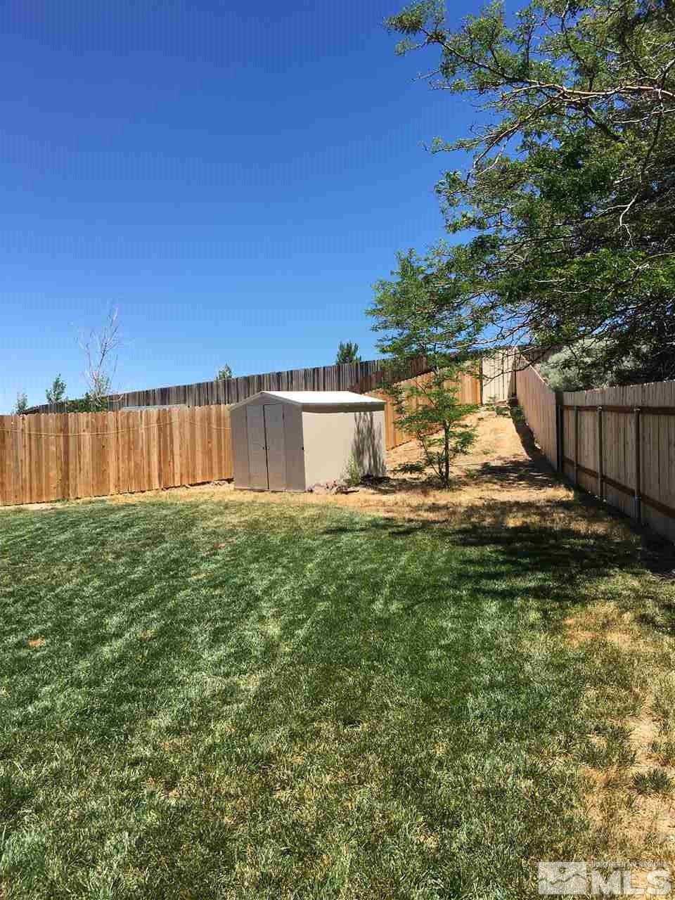 10003 Albite Street Reno, NV 89506 - Photo 6 of 25 a view of a house with a yard