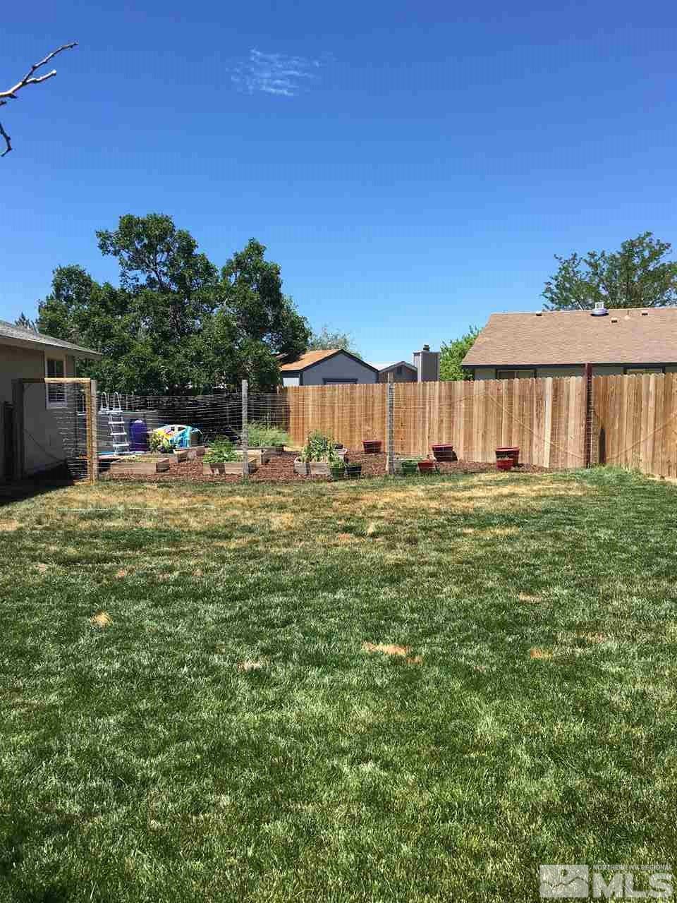 10003 Albite Street Reno, NV 89506 - Photo 7 of 25 a view of a house with yard and sitting area