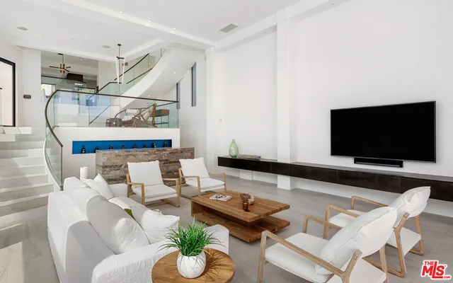 a view of entryway with wooden floor and stairs