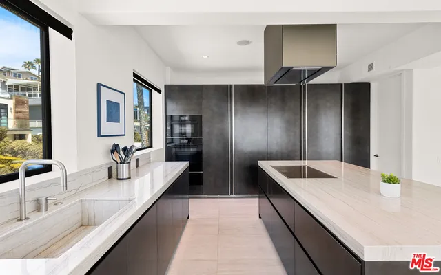 a bedroom with a bed and large tv