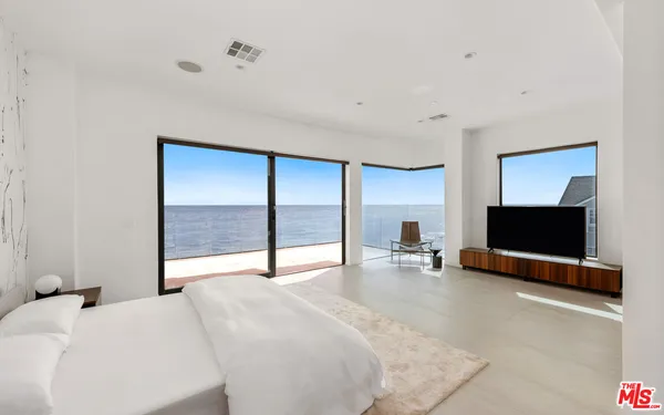 a view of a livingroom with a flat screen tv and fireplace