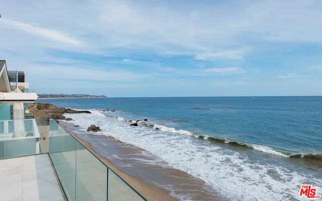 a bathroom with a tub and shower
