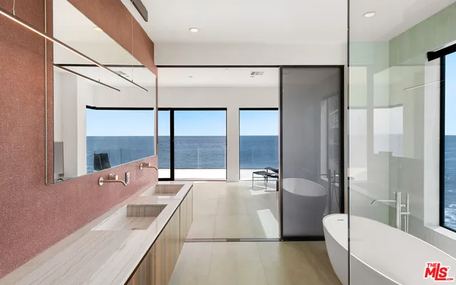 a living room with furniture and a lamp