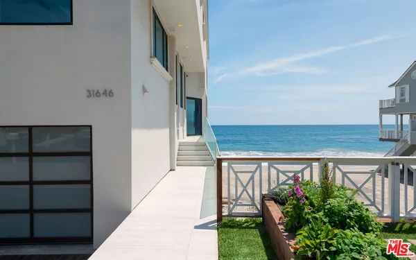 a view of balcony with outdoor seating and plants