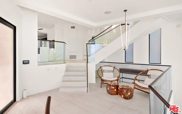 a view of staircase with furniture and stairs