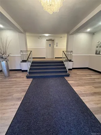 a view of a hallway with stairs