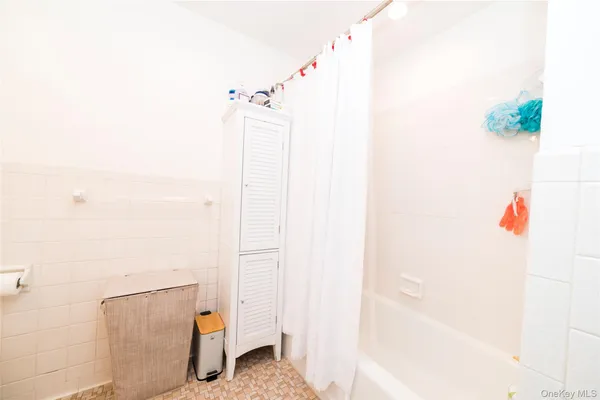 a bathroom with a shower and a shower