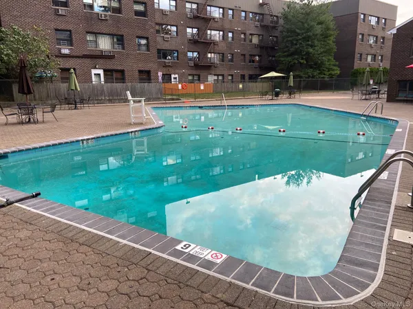 a view of a swimming pool with a yard
