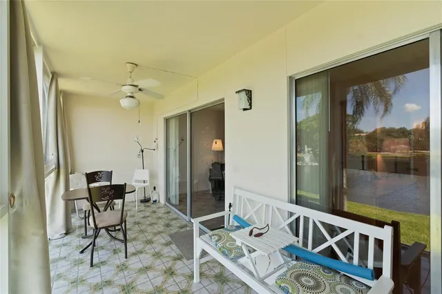 a view of a hallway with furniture and front door