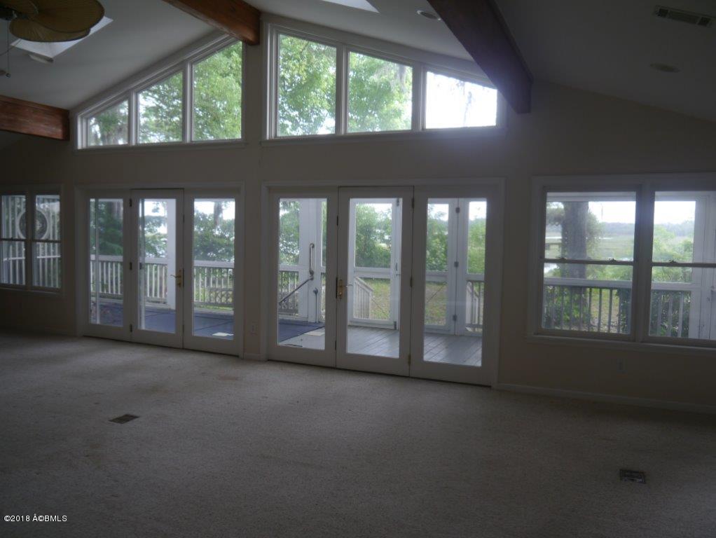 7609 Patterson Road Beaufort, SC 29906 - Photo 7 of 34 FAMILY ROOM TO SCREENED PORCH
