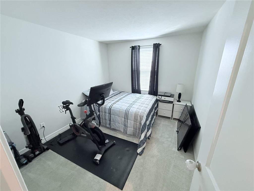 128 Jerome Drive Butler, PA 16001 - Photo 15 of 24 a bedroom with a bed and wooden floor