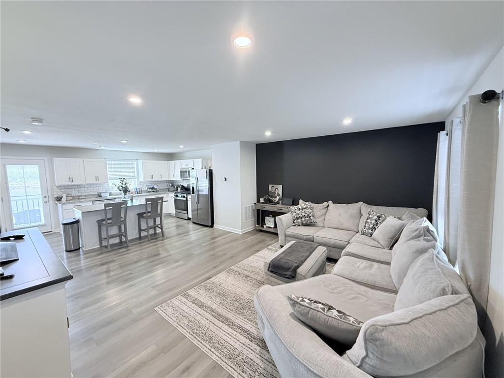 128 Jerome Drive Butler, PA 16001 - Photo 2 of 24 a living room with furniture and view of kitchen