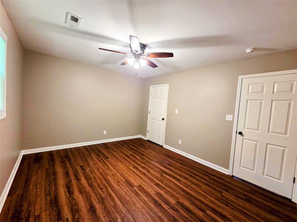 509 Elrod Road Piedmont, SC 29673 - Photo 21 of 28 A comfortable bedroom boasts rich wood flooring and a refreshing ceiling fan.