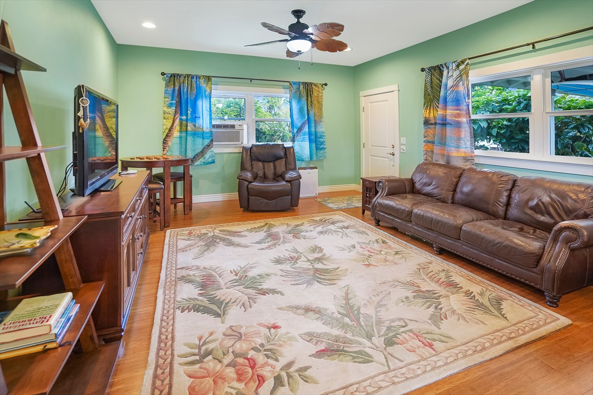 5273 Kawaihau Road, Unit 1 Kapaa, HI 96746 - Photo 15 of 16 a living room with furniture and a large window
