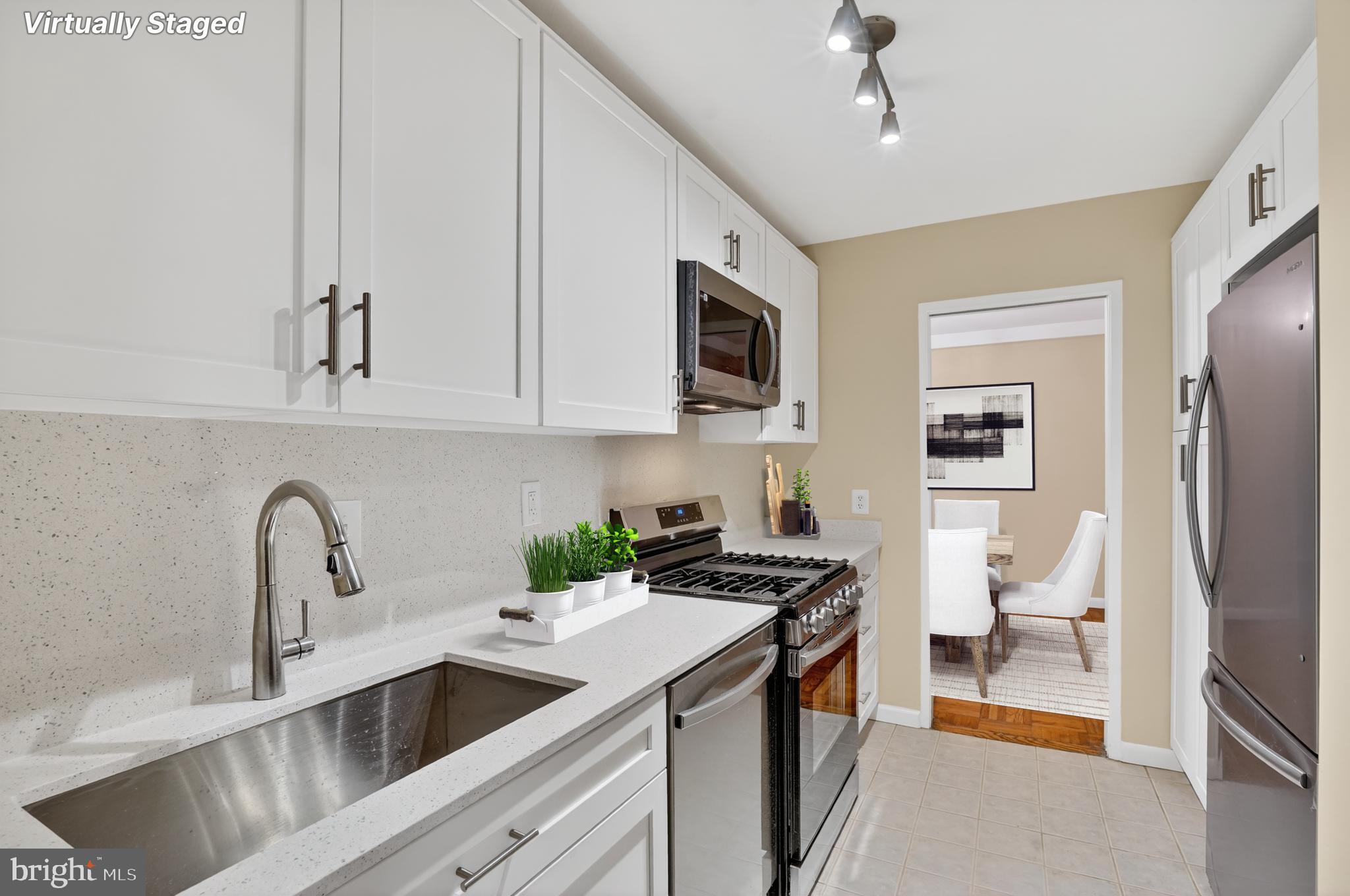 3900 Tunlaw Road Northwest, Unit 103 Washington, DC 20007 - Photo 10 of 41 a kitchen that has a sink and a stove
