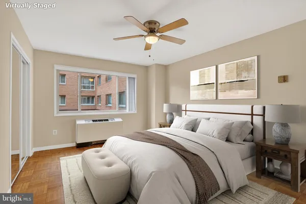 a bedroom with a bed and window