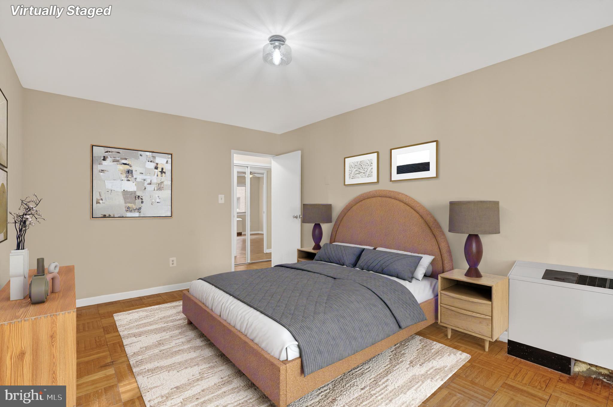 3900 Tunlaw Road Northwest, Unit 103 Washington, DC 20007 - Photo 13 of 41 a bedroom with bed and a night stand