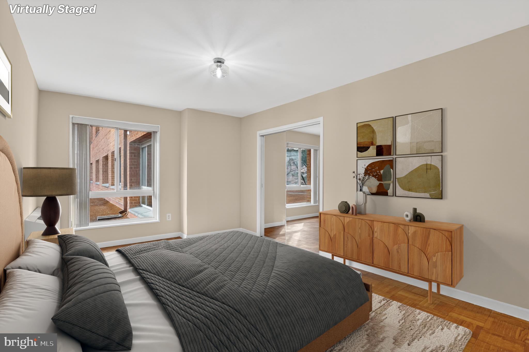 3900 Tunlaw Road Northwest, Unit 103 Washington, DC 20007 - Photo 14 of 41 a spacious bedroom with a bed and cabinets