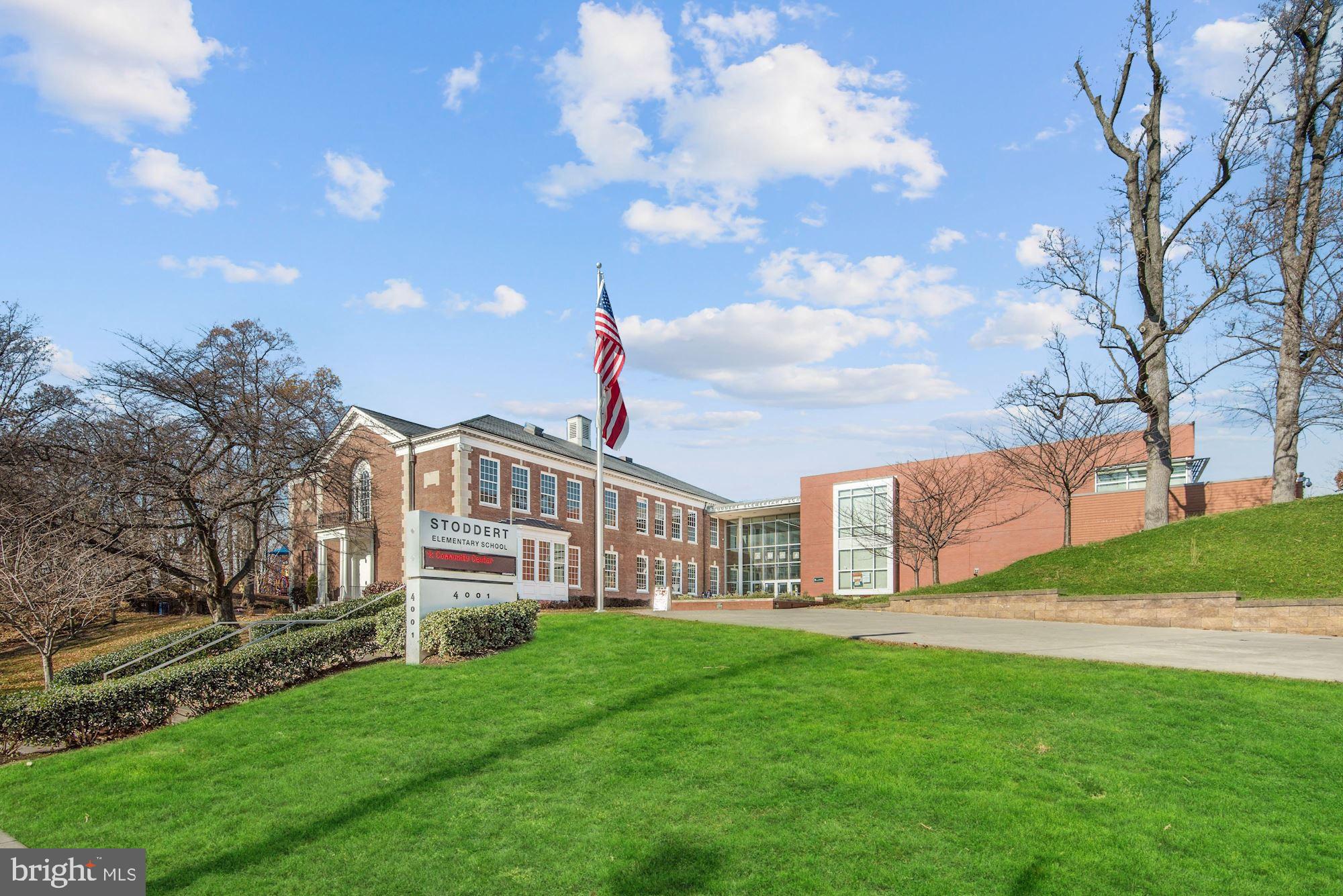 3900 Tunlaw Road Northwest, Unit 103 Washington, DC 20007 - Photo 31 of 41 a front view of a house with garden