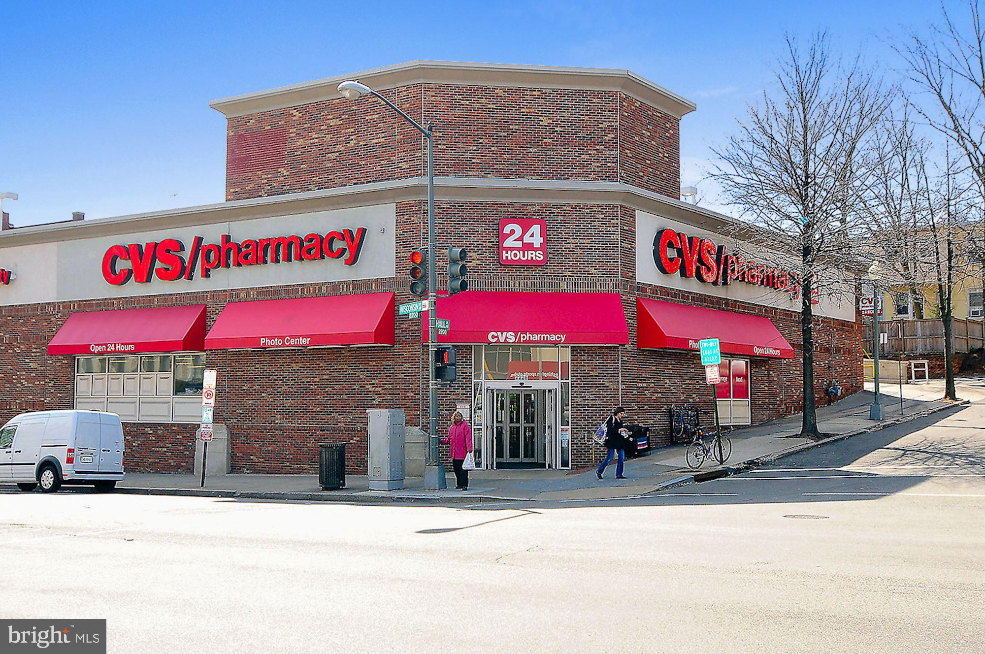 3900 Tunlaw Road Northwest, Unit 103 Washington, DC 20007 - Photo 35 of 41 a street sign on a street corner