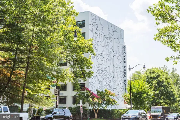 front view of a building with trees