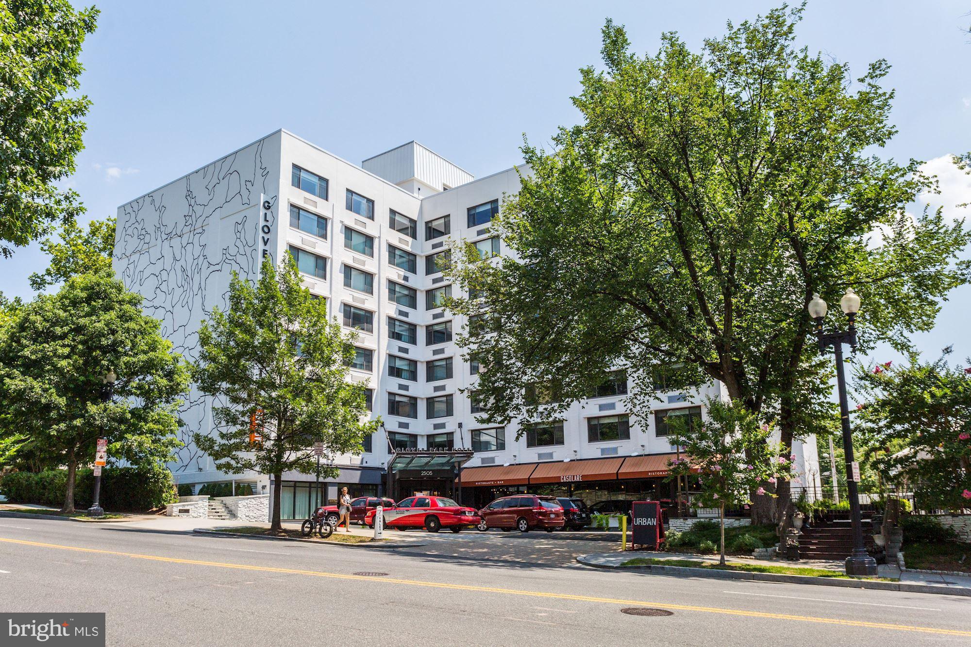3900 Tunlaw Road Northwest, Unit 103 Washington, DC 20007 - Photo 38 of 41 front view of a building with trees