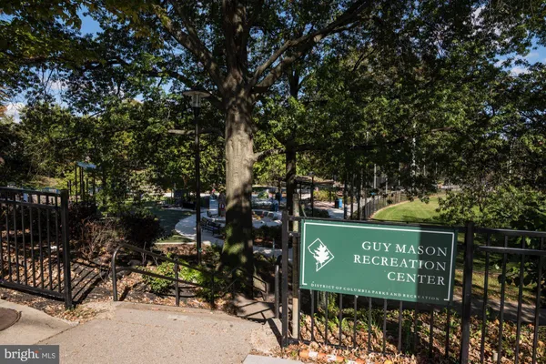 a view of path along with retail shop and buildings