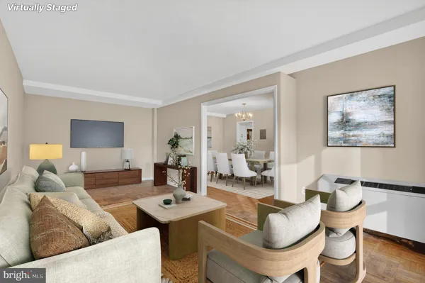 a living room with fireplace furniture and a table
