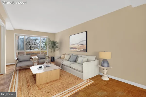 a living room with furniture and a window