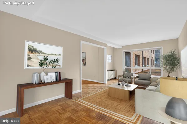 a living room with furniture and a window