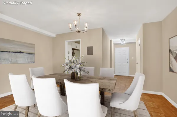 a view of a dining room with furniture and wooden floor