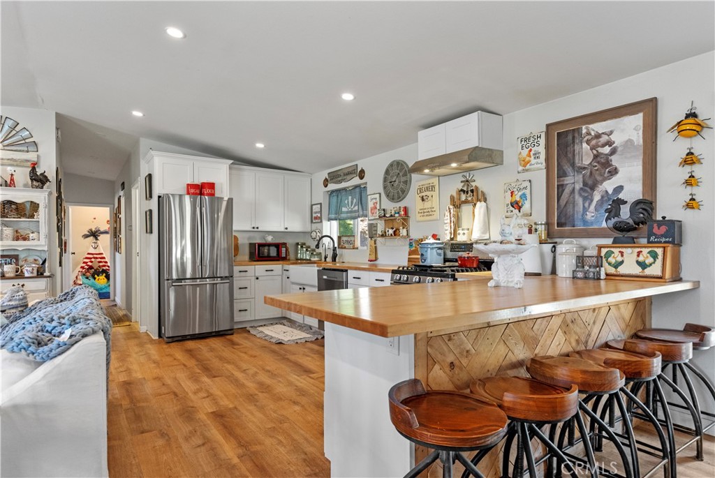 17500 High Gun Drive Tehachapi, CA 93561 - Photo 23 of 46 a kitchen with stainless steel appliances granite countertop a refrigerator and a stove