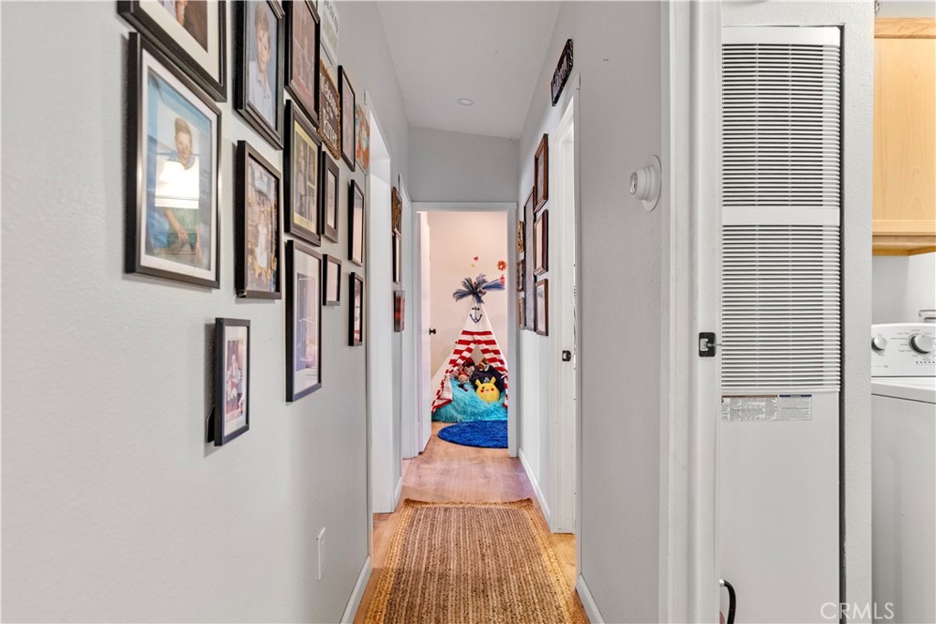 17500 High Gun Drive Tehachapi, CA 93561 - Photo 28 of 46 a view of a hallway with paintings on the wall