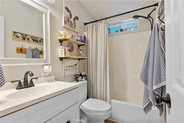 a bedroom with bed and wooden floor