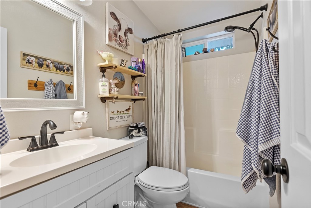 17500 High Gun Drive Tehachapi, CA 93561 - Photo 30 of 46 a bathroom with a sink toilet and shower