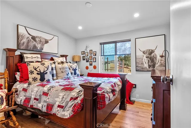 a bedroom with a bed and a dresser in it