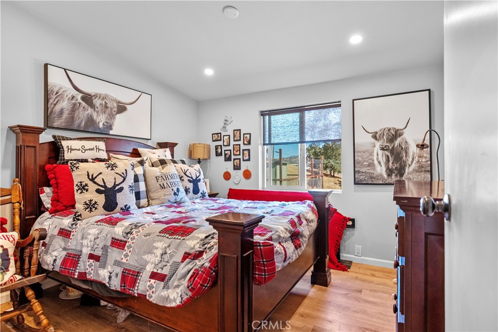 17500 High Gun Drive Tehachapi, CA 93561 - Photo 31 of 46 a bedroom with bed and wooden floor