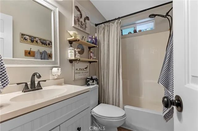 a bedroom with furniture and a large window